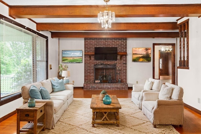 1144 Miller Rd, Lewisburg, TN 37091 - living room featuring a chandelier, beamed ceiling, wood finished floors, baseboards, and a fireplace