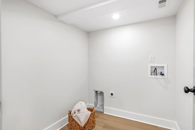 clothes washing area featuring hookup for a washing machine, hardwood / wood-style floors, and electric dryer hookup