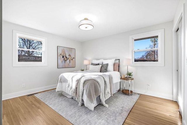 bedroom with wood-type flooring