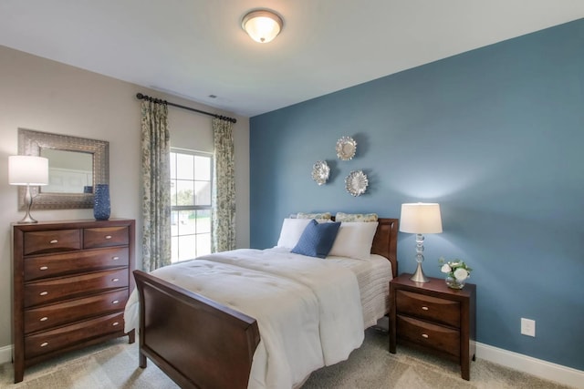 bedroom with light colored carpet