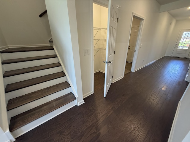 stairs featuring baseboards and wood finished floors