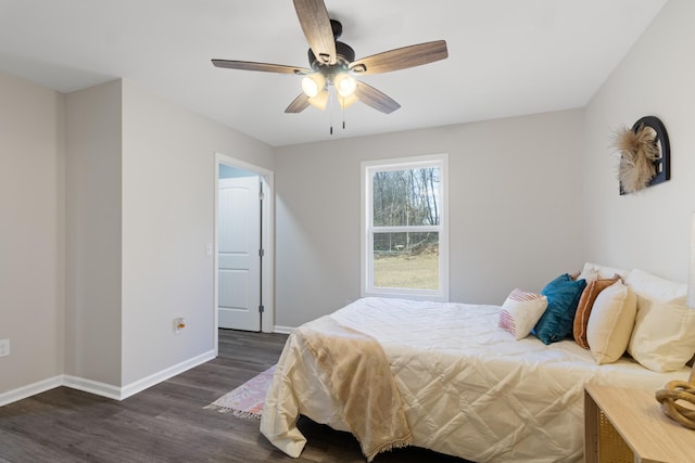 bedroom featuring dark wood-style floors, baseboards, and a ceiling fan