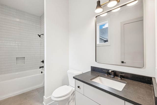 full bathroom with tiled shower / bath, vanity, toilet, and tile patterned flooring