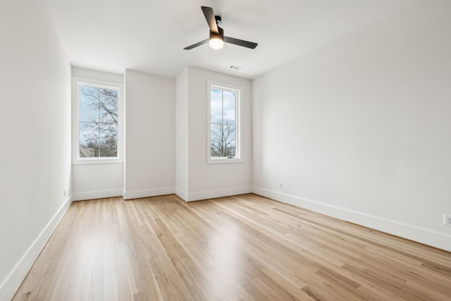 unfurnished room featuring ceiling fan and light hardwood / wood-style flooring