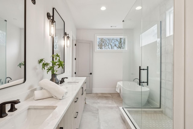 bathroom featuring vanity and separate shower and tub