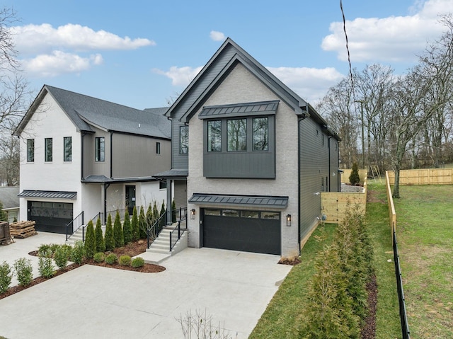 view of front of property with a garage and a front yard