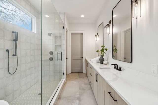 bathroom featuring vanity and walk in shower