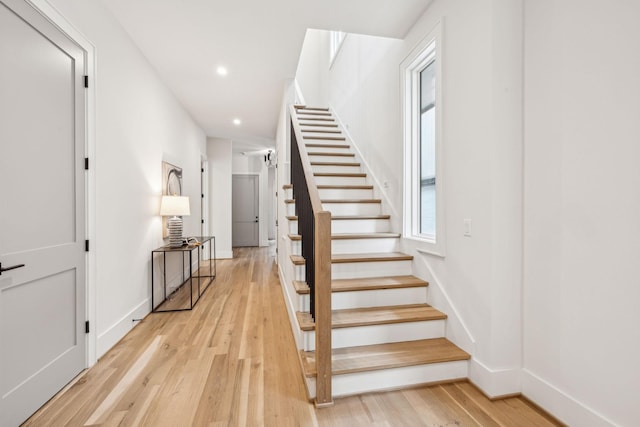 staircase featuring hardwood / wood-style flooring