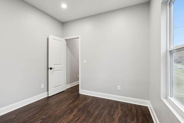 spare room featuring dark hardwood / wood-style floors