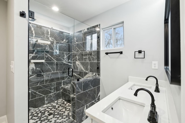 bathroom featuring vanity and an enclosed shower