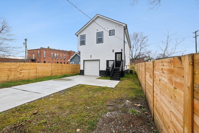 back of house with a garage