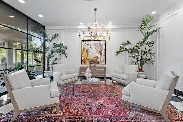 living room with an inviting chandelier, crown molding, and expansive windows