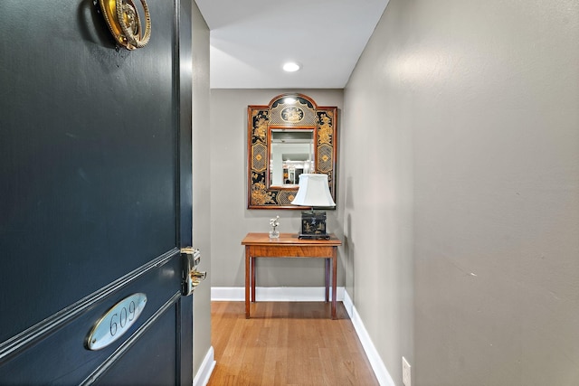 doorway to outside with wood-type flooring