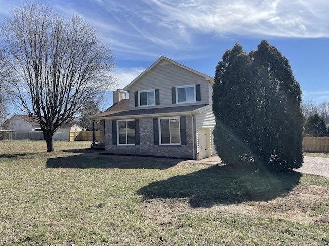 view of front of property featuring a chimney, fence, a front lawn, and brick siding