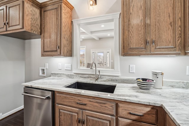 kitchen featuring beamed ceiling, sink, coffered ceiling, stainless steel dishwasher, and light stone countertops