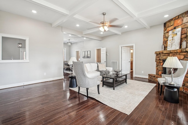 living room featuring beamed ceiling, ceiling fan, coffered ceiling, and dark hardwood / wood-style flooring