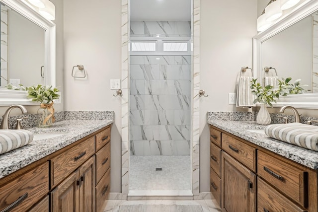 bathroom featuring vanity and tiled shower