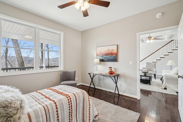 bedroom with dark wood-type flooring and ceiling fan