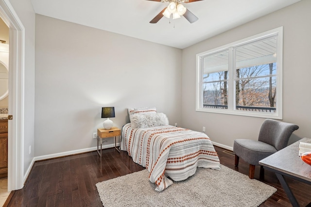 bedroom with dark hardwood / wood-style floors and ceiling fan