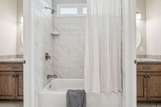 bathroom with vanity and shower / bath combination with curtain