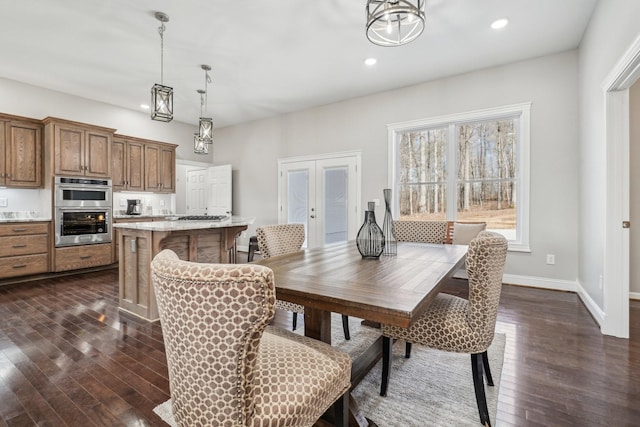 dining space with french doors and dark hardwood / wood-style floors