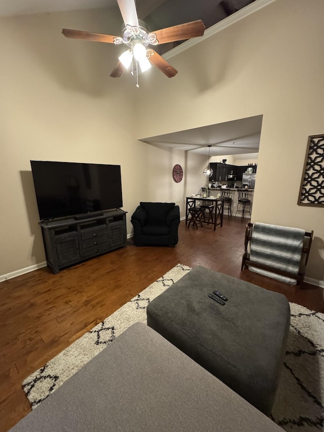 living room with dark hardwood / wood-style floors and ceiling fan