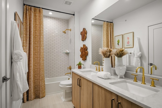 full bathroom with shower / bath combo, vanity, and toilet