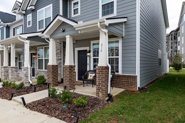 property entrance with covered porch