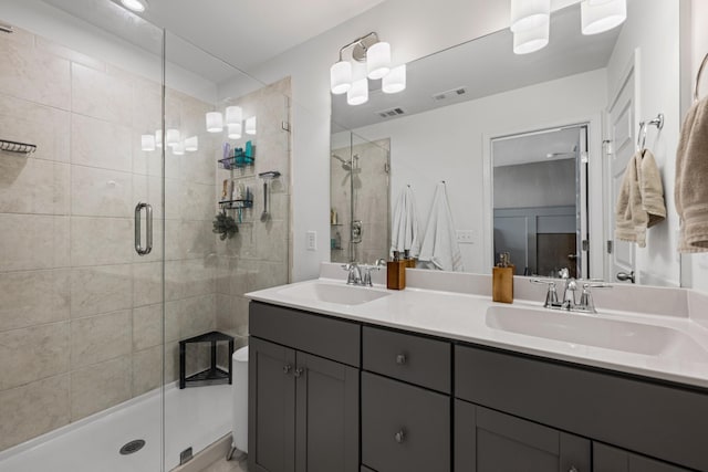 bathroom featuring vanity and an enclosed shower