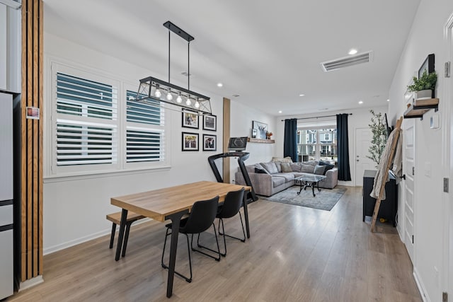 dining room with light hardwood / wood-style floors