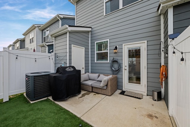 view of patio with a grill and central AC unit