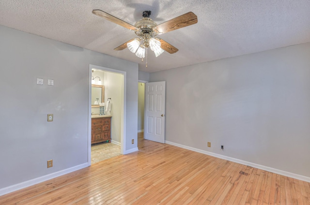 2146 Berkshire Ln, Murfreesboro, TN 37129 - unfurnished bedroom featuring baseboards, a textured ceiling, and light wood-style flooring