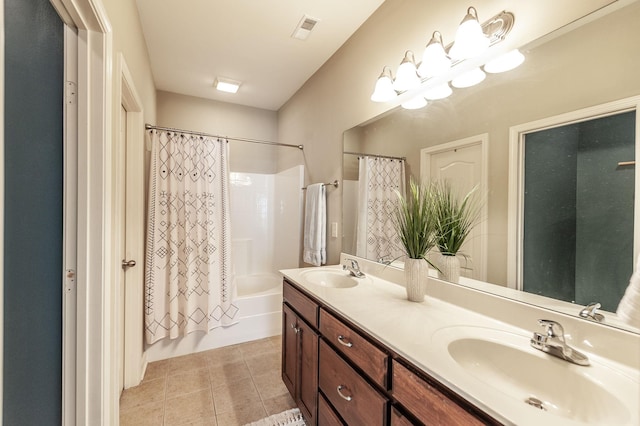 bathroom with tile patterned flooring, shower / tub combo with curtain, and vanity