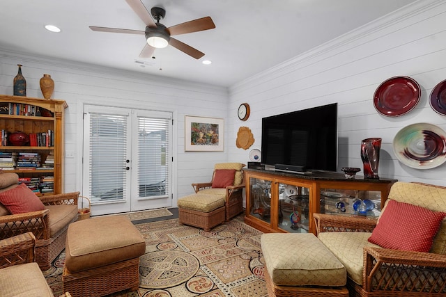 living room featuring ornamental molding and ceiling fan