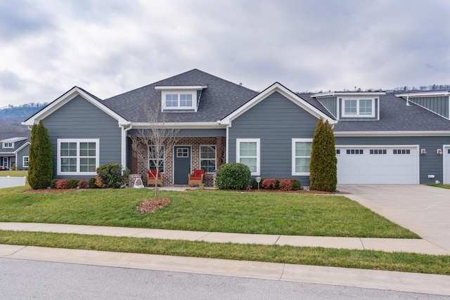 craftsman-style home with a garage and a front lawn