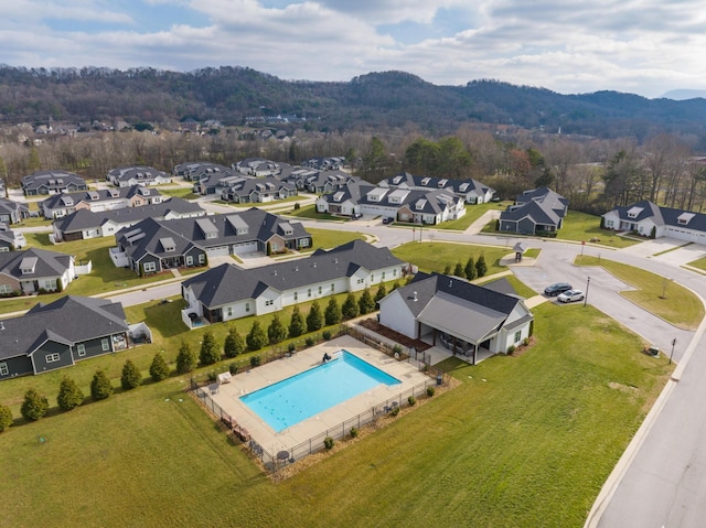 birds eye view of property with a mountain view