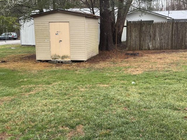 view of outbuilding with a lawn