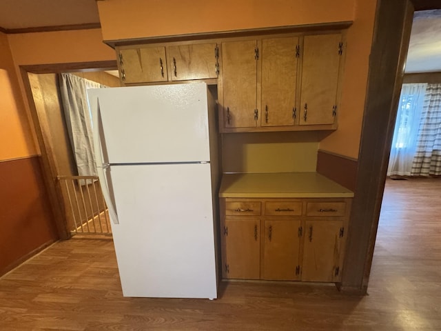 kitchen with white fridge and light wood-type flooring