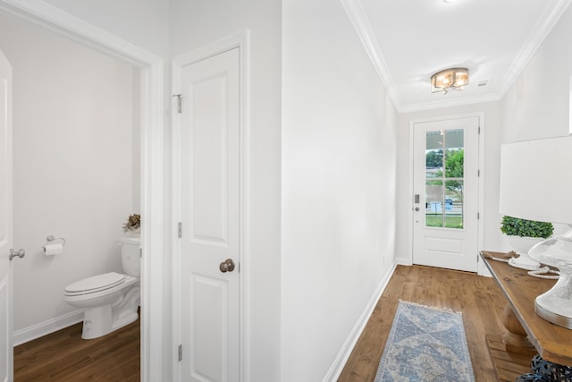 doorway to outside with ornamental molding and wood-type flooring