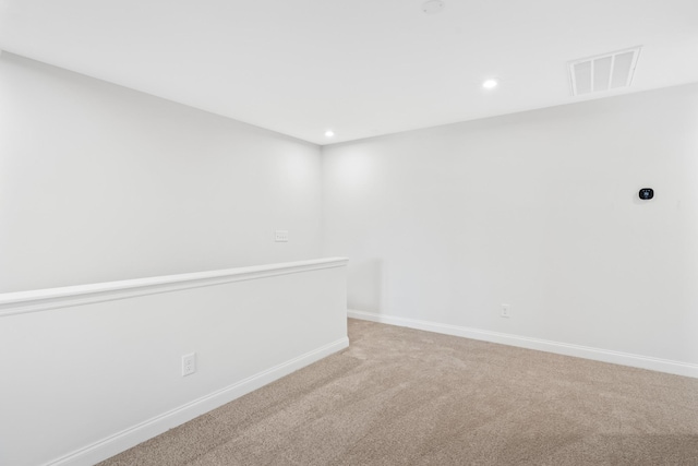 empty room with light colored carpet