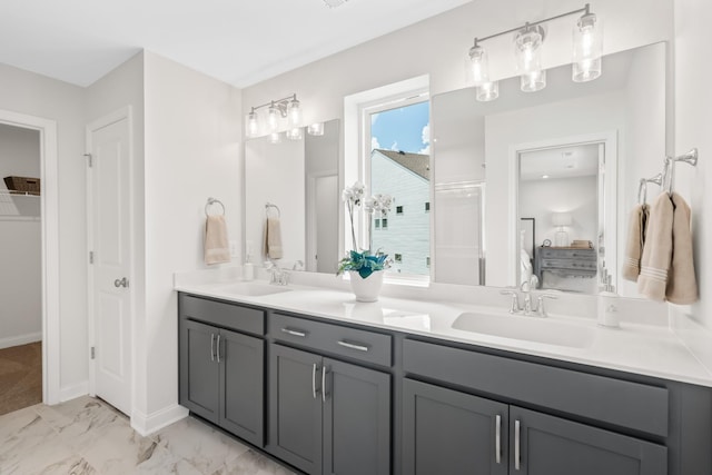 bathroom featuring vanity and a shower with shower door