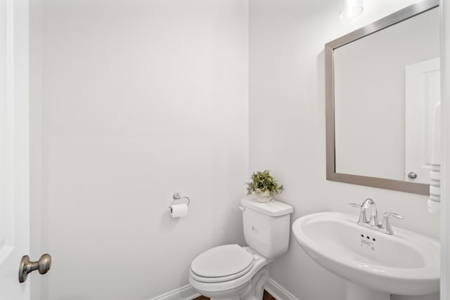 bathroom featuring sink and toilet