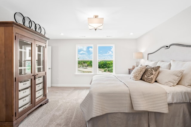 bedroom featuring light colored carpet