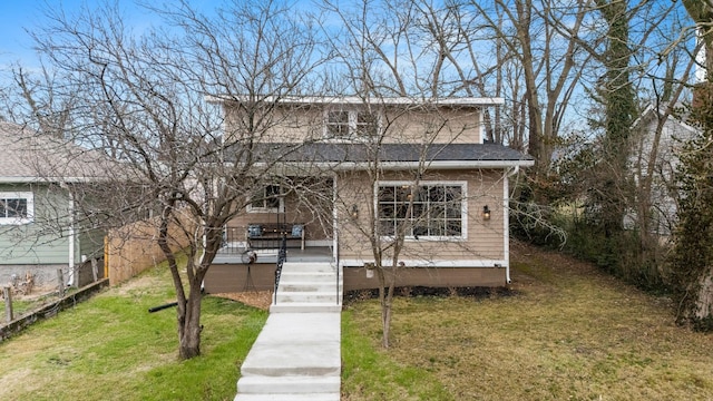 bungalow-style house featuring a front yard