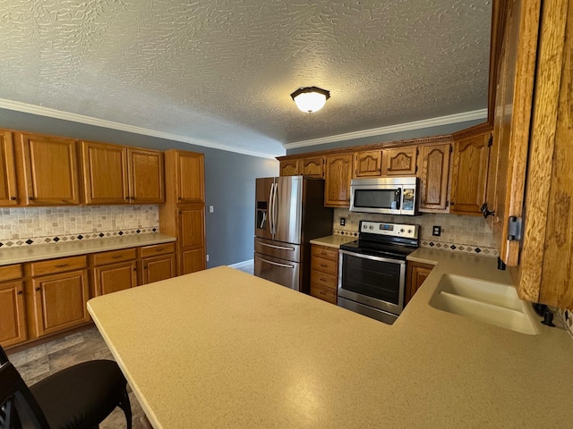 kitchen with tasteful backsplash, appliances with stainless steel finishes, crown molding, and light countertops