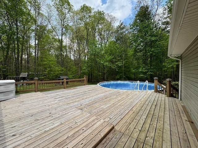 238 Laurens Ln, Grimsley, TN 38565 - wooden terrace with an outdoor pool