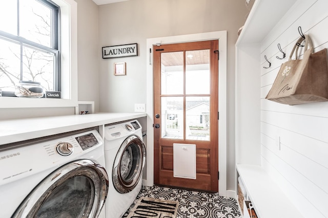 washroom with tile patterned floors and washing machine and dryer