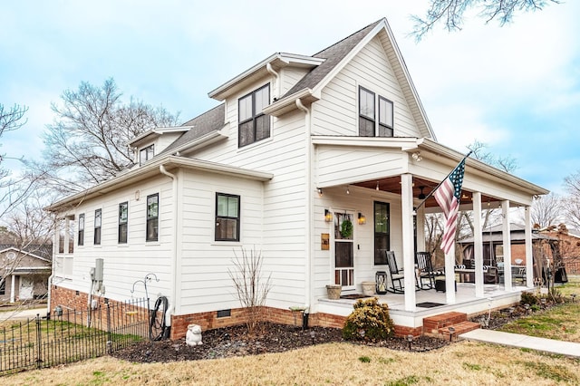 view of front of home with covered porch and a front yard