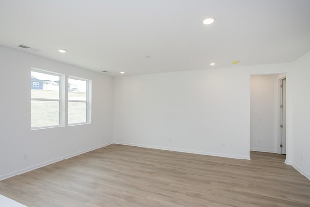 spare room with light hardwood / wood-style floors