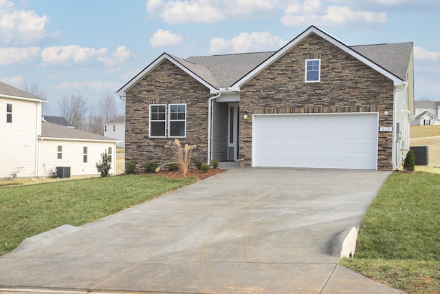 view of front of home with central AC unit, a garage, and a front lawn